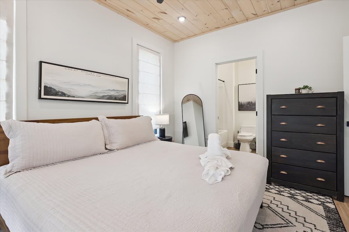 Bedroom Retreat: Relax in a stylish haven with mountain views, chic decor, and modern comforts!