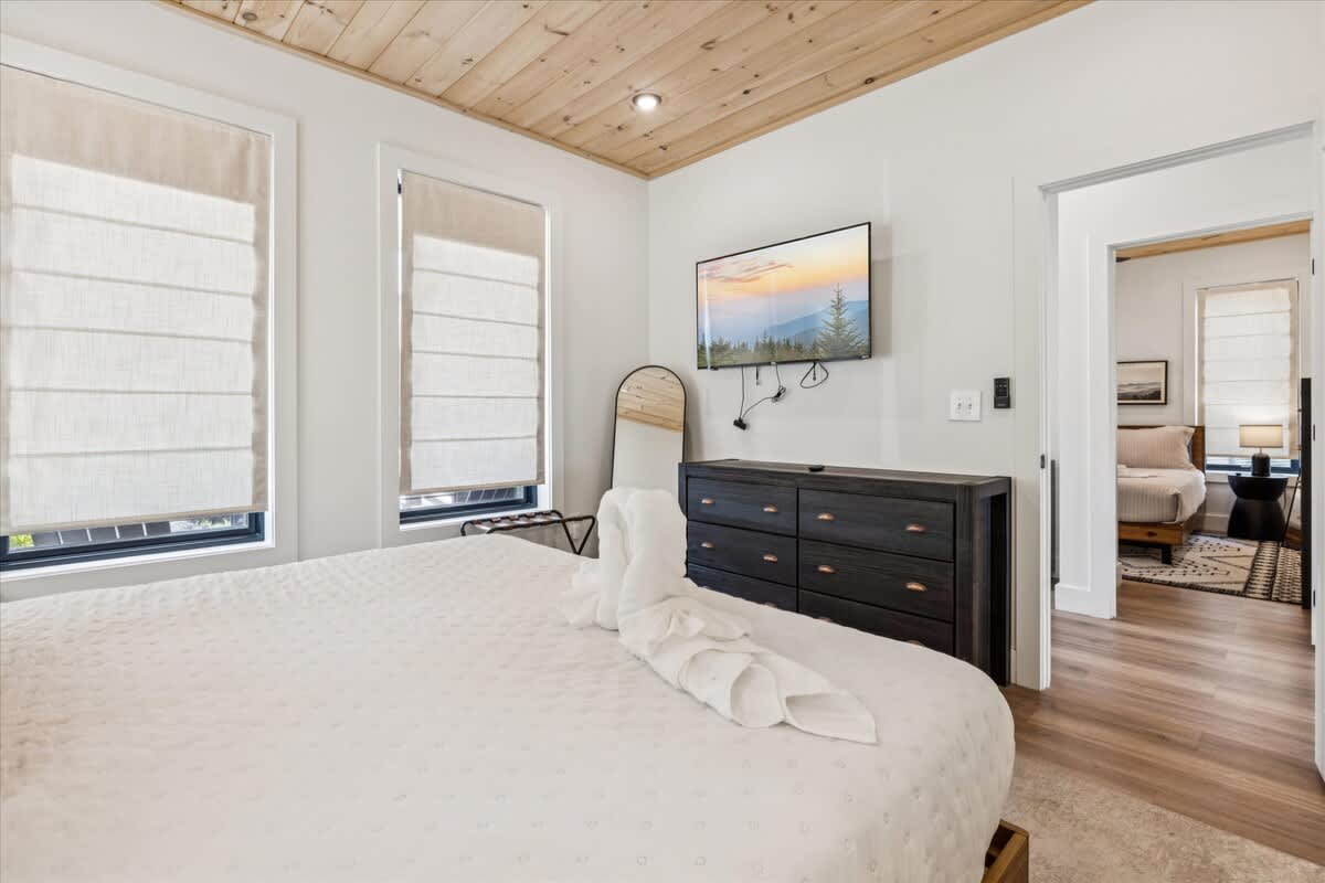Relax in this serene retreat with a SmartTV and modern decor!