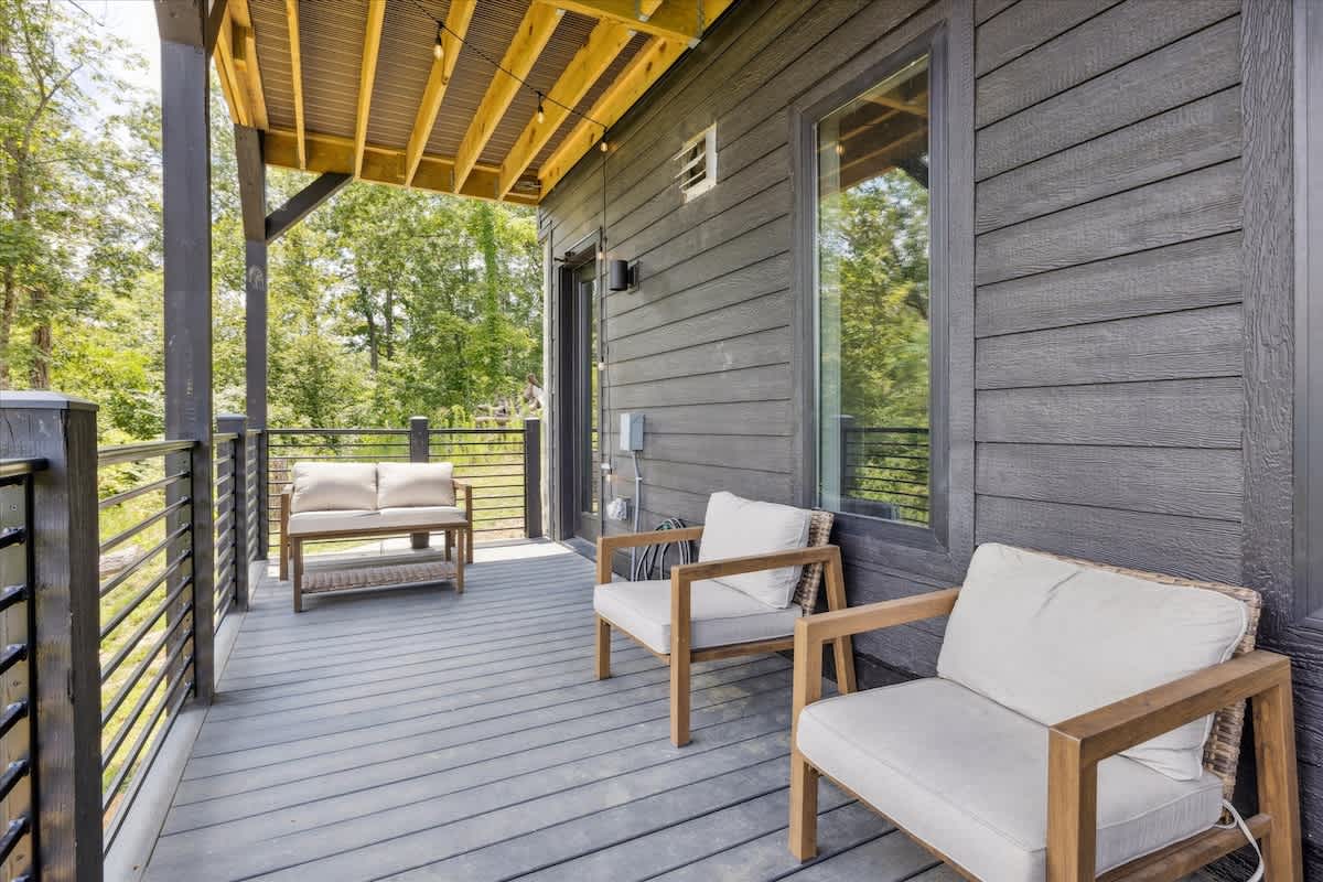 Enjoy tranquil views from this inviting space, perfect for morning coffee or evening chats!