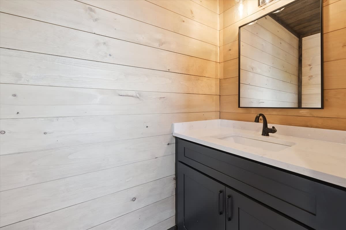 Bathroom Retreat: Sleek design with wooden accents and modern finishes—your perfect getaway!