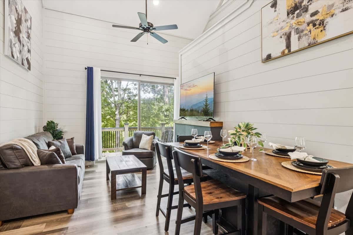 Modern lakehouse charm meets cozy comfort in the spacious main living area.