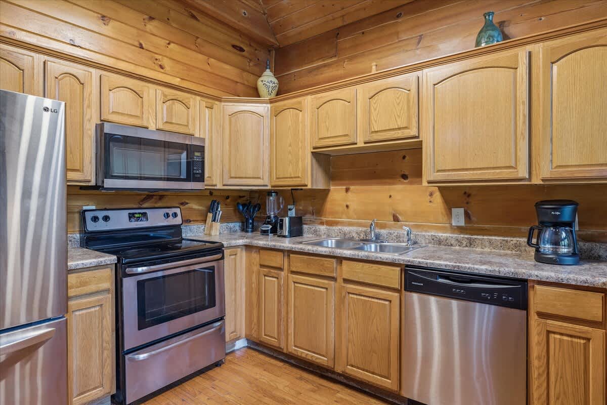 Kitchen: Cook up a storm with modern appliances and rustic charm in this inviting space!