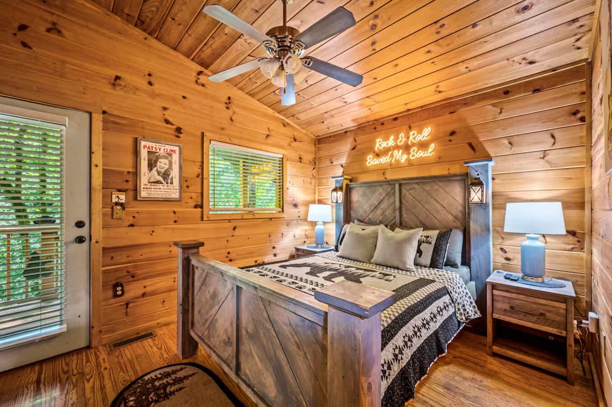 Primary bedroom with queen bed offers cozy comfort and rustic elegance for restful nights.