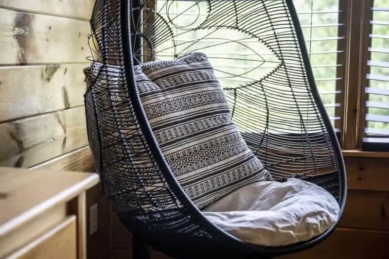 Sink into the cozy chair in the primary suite for a quiet moment.