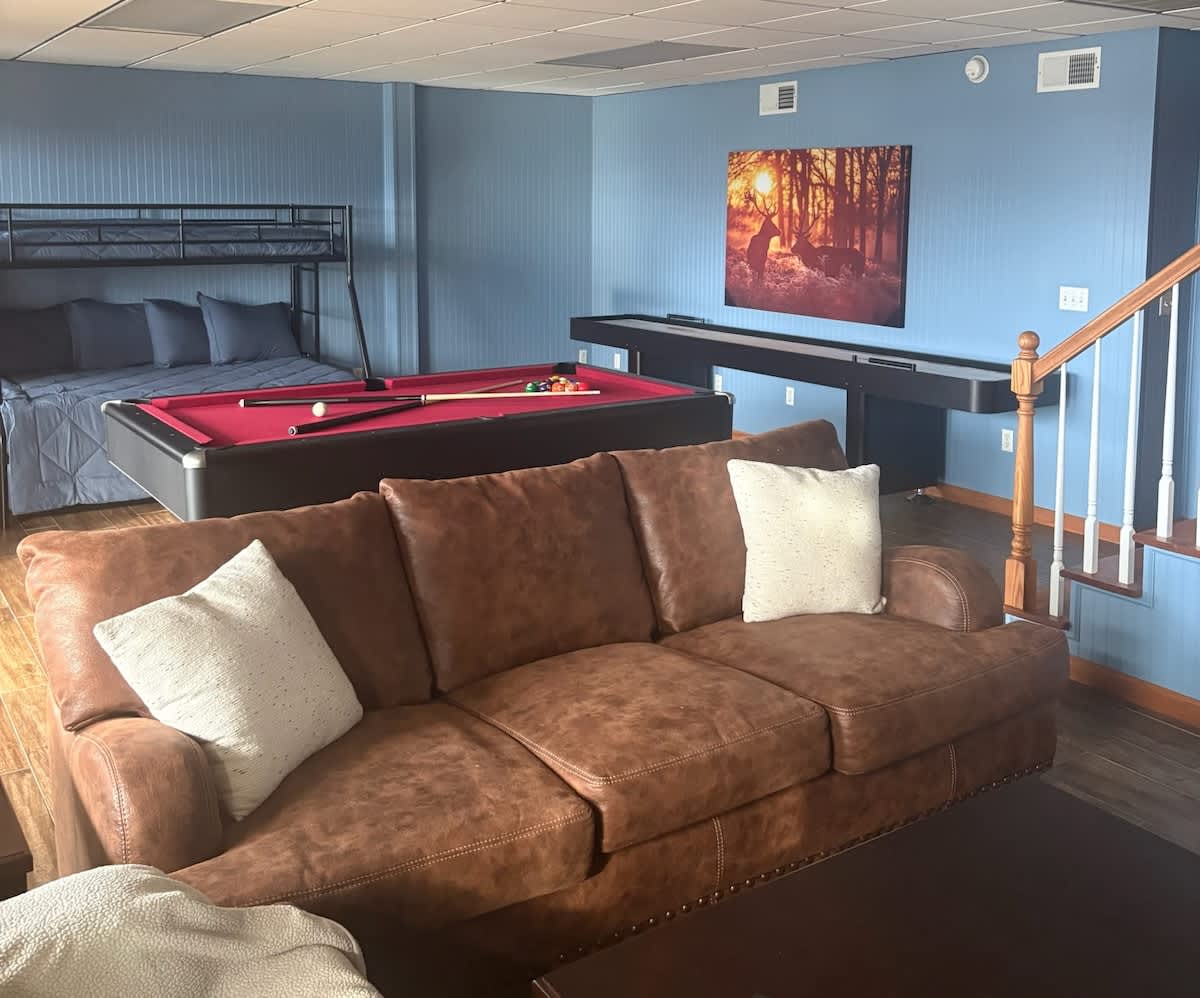 Enjoy friendly competition with a pool table and comfy seating for unforgettable fun!