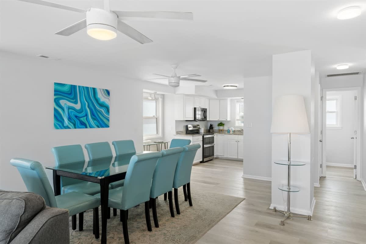 Dining Room: Gather around the sleek glass table and enjoy beachside meals in style!
