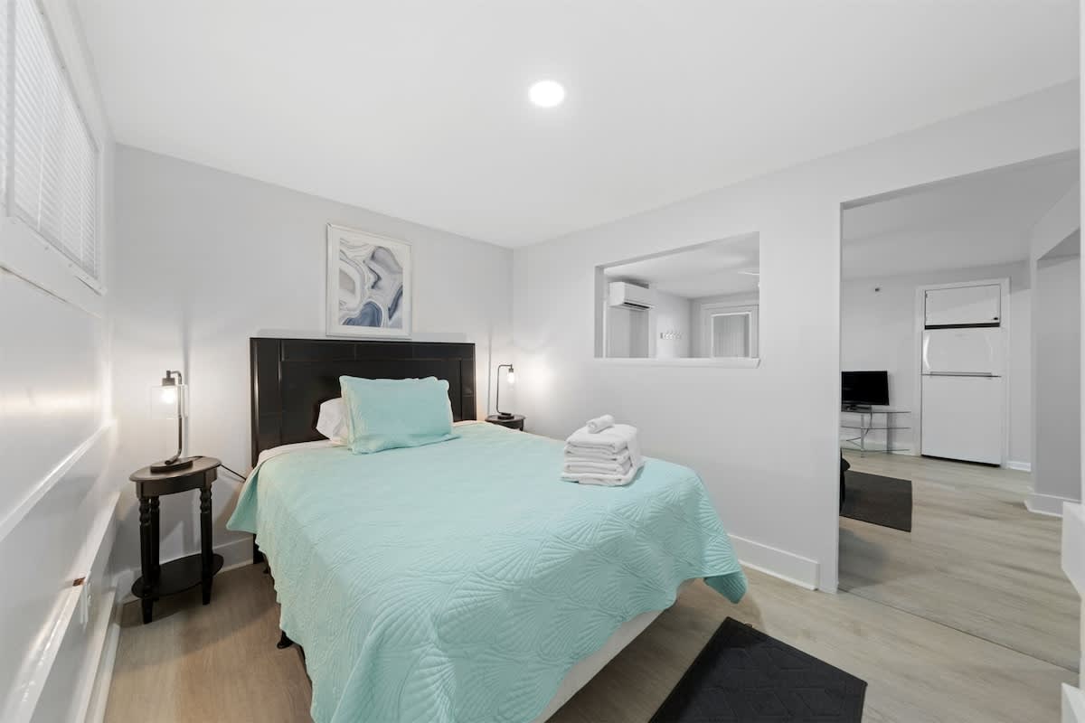 Charming Bedroom: Relax in a serene retreat with coastal hues and modern amenities!