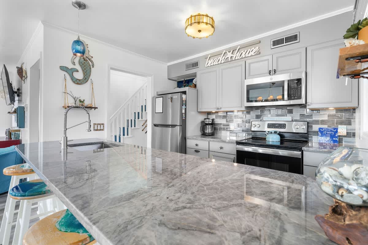 Kitchen: Bright and inviting space with stylish decor, perfect for culinary adventures!