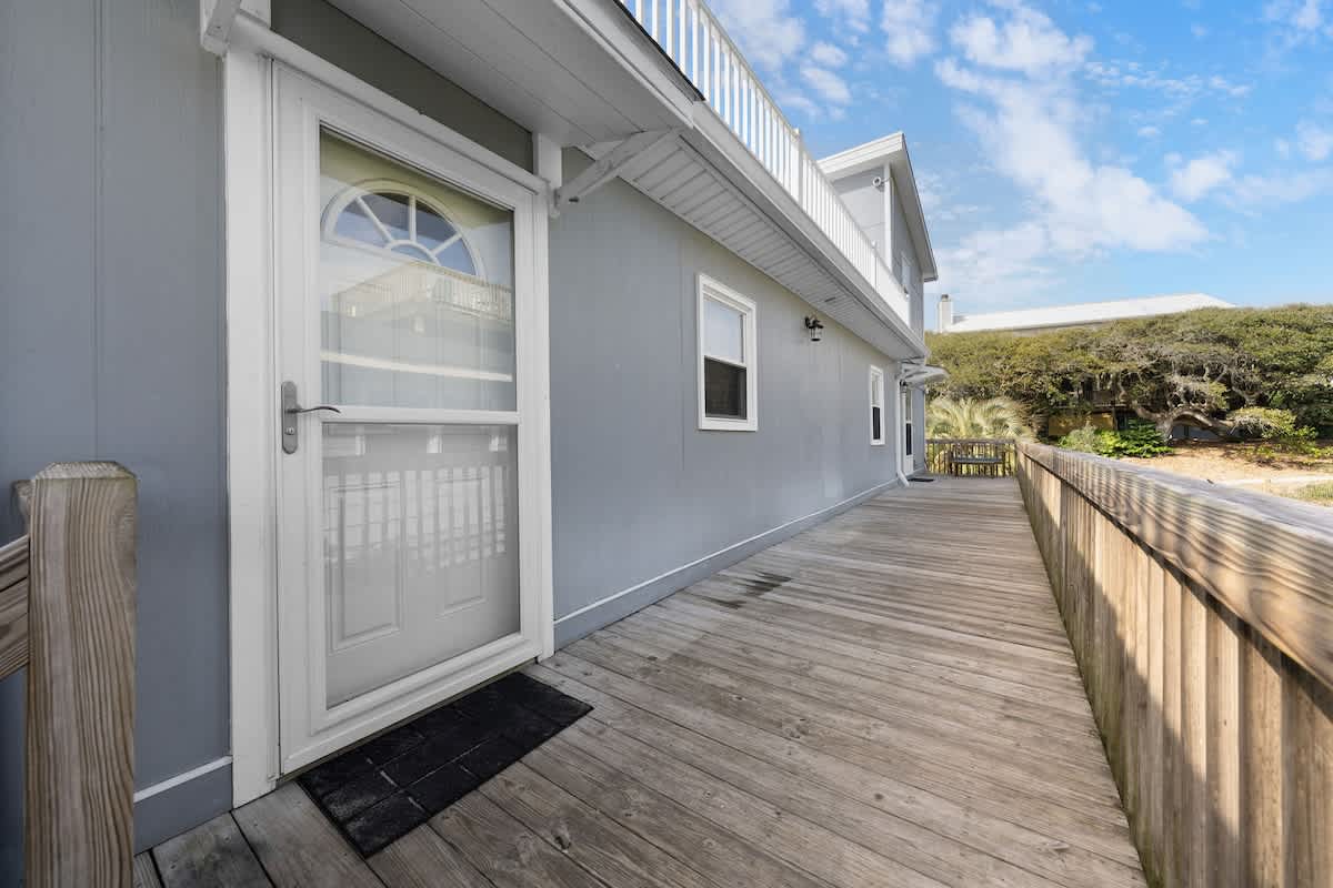 Step into beach vibes with this charming boardwalk access to paradise!