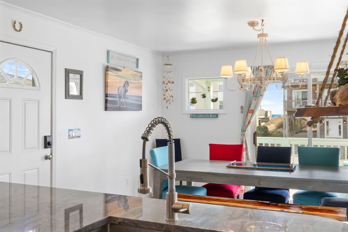 Dining Area: Bright, cheerful space with ocean views and vibrant seating—perfect for memorable meals!