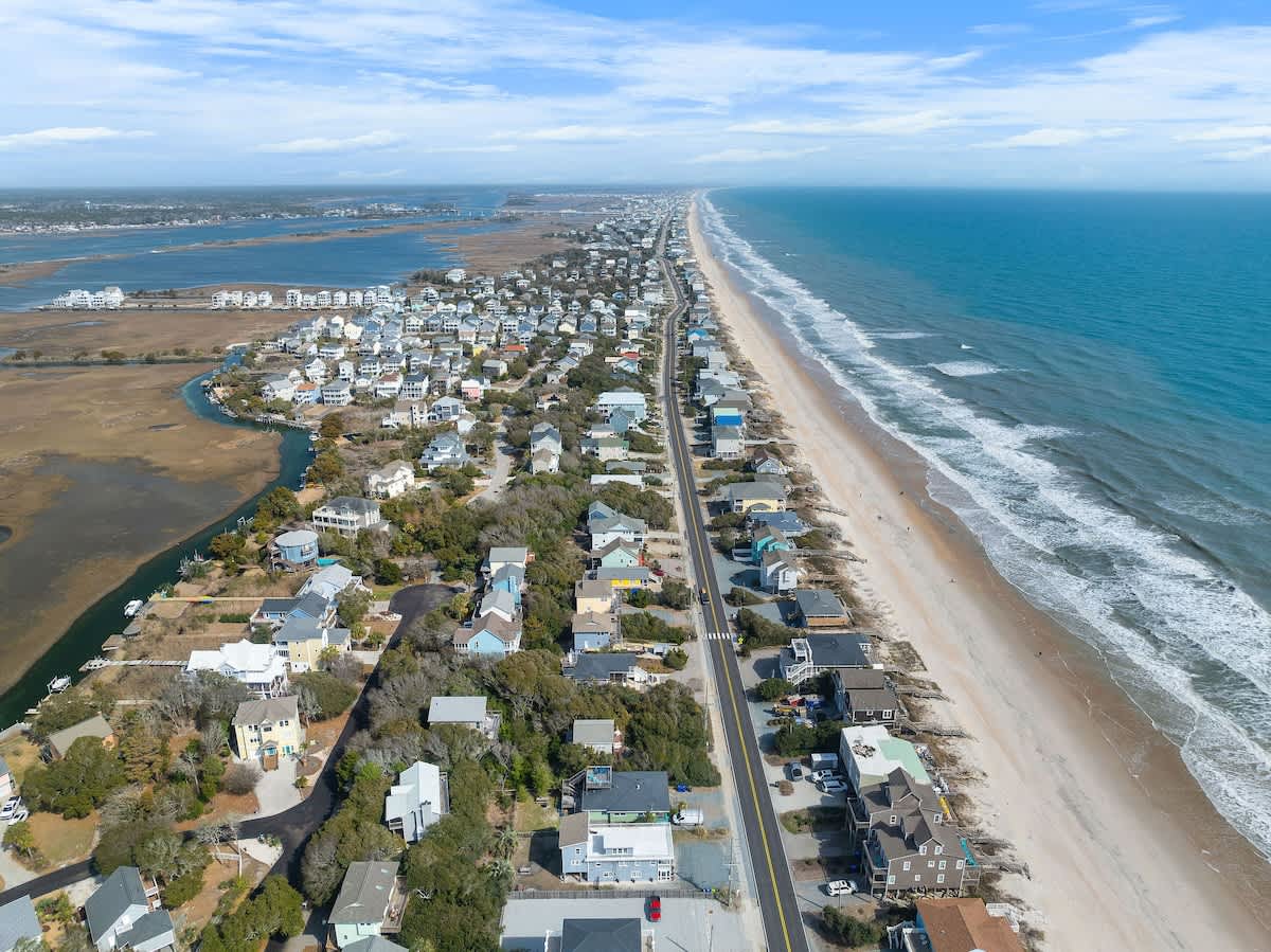 Stunning coastal scenery with serene waters and sandy shores just steps away!