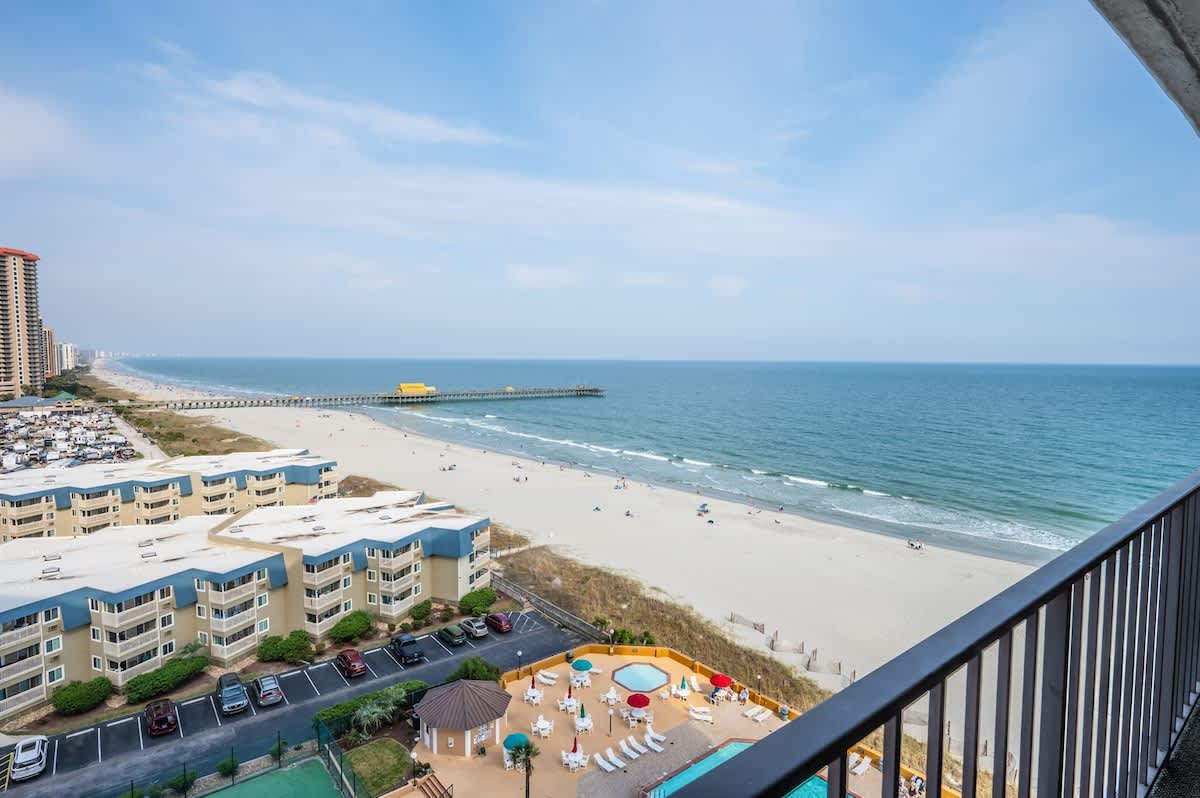 - Balcony view overlooking Myrtle Beach coastline and sparkling ocean   - Stunning spot for sunrise coffee or evening gatherings with friends   - Panoramic scenery includes pier skyline and wide sandy beachfront