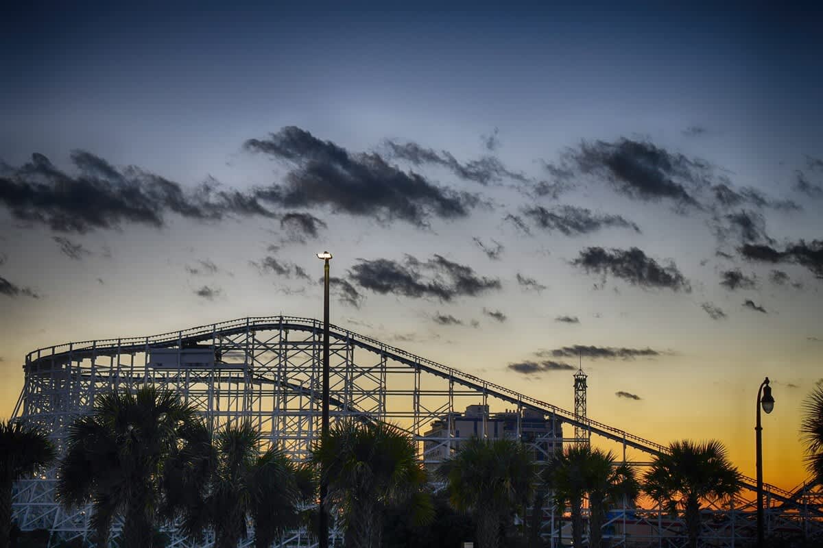 Just a short drive away, catch a breathtaking sunset behind the roller coaster, creating the perfect end to a fun filled day.