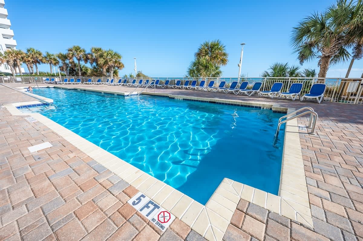 Take a dip in this refreshing pool with the beach just steps away.