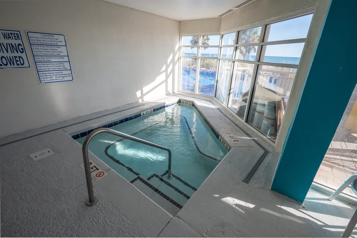 - Indoor hot tub with windows overlooking the pool deck   - Relax and unwind in bubbling water after beach time   - Comfortable setting perfect for evening relaxation