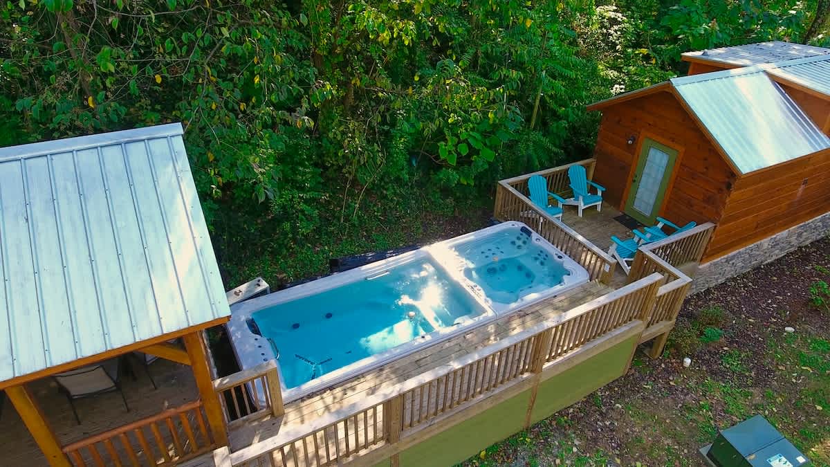 Bryce and it's neighboring cabin, River share a swim spa and hot tub.