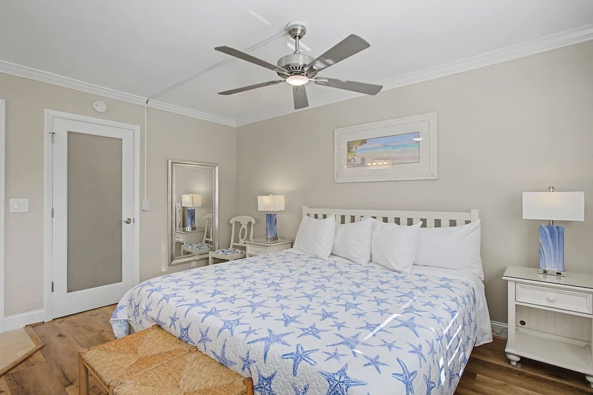 Drift off in this coastal-themed bedroom where starfish patterns and soothing blues create your peaceful seaside retreat.