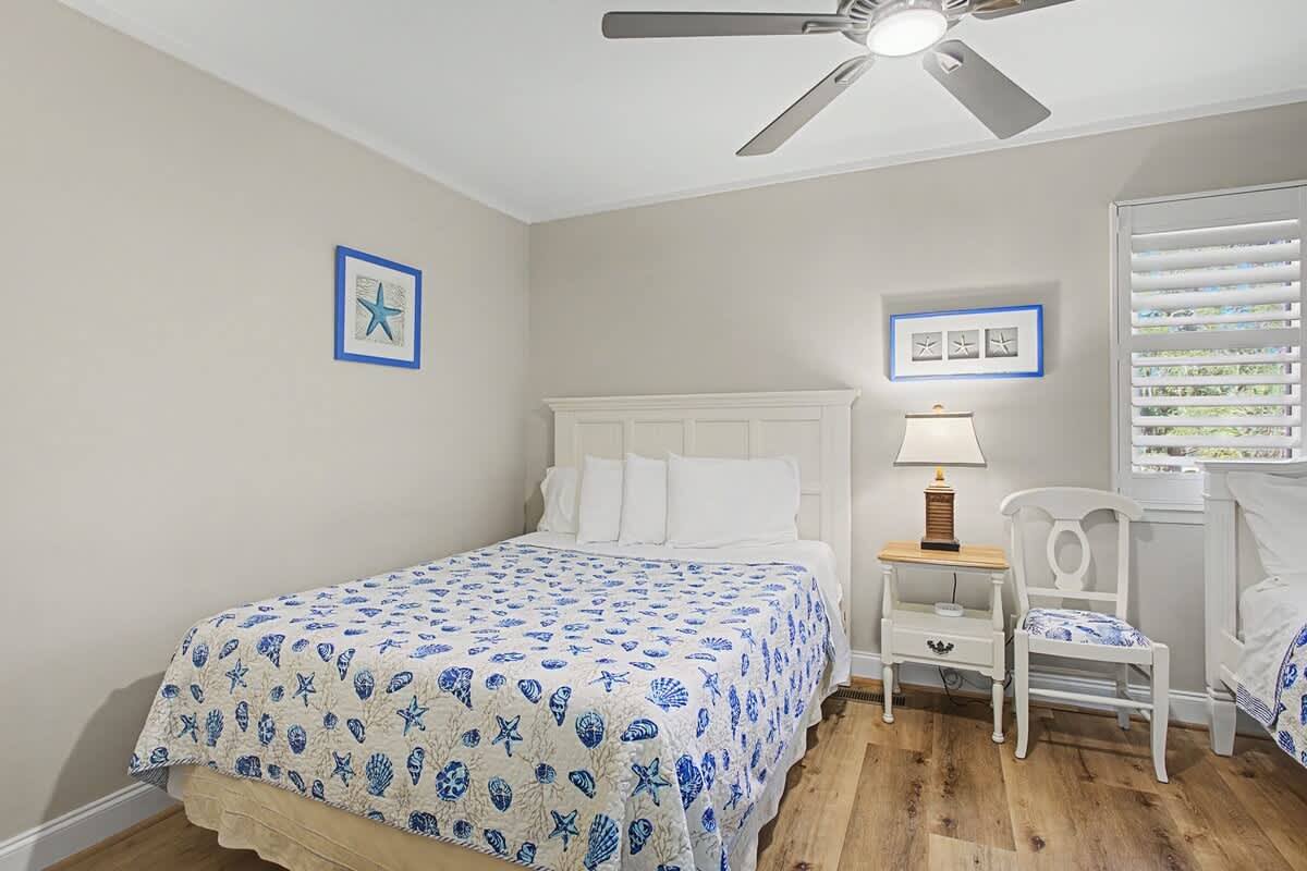Drift off in your charming coastal bedroom with ocean-themed linens and soothing sea-inspired decor creating the perfect beachside retreat.