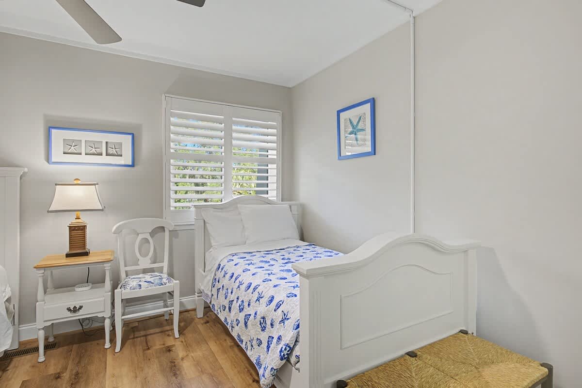 Drift off in this charming coastal bedroom where soft blues and whites create your peaceful seaside sanctuary.