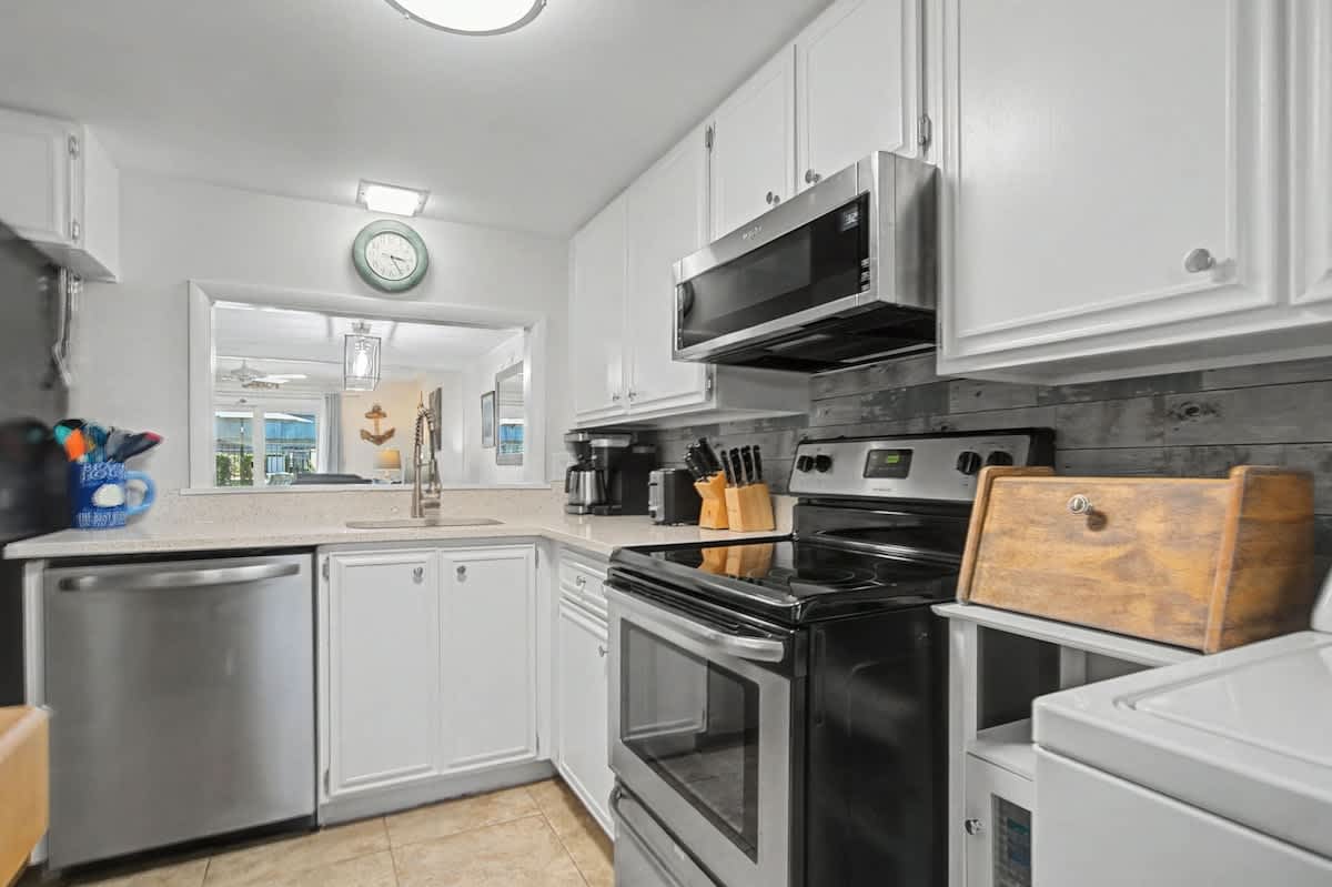 Bright and inviting, this fully equipped kitchen offers everything you need for effortless vacation living - perfect for morning coffee and casual lunches.