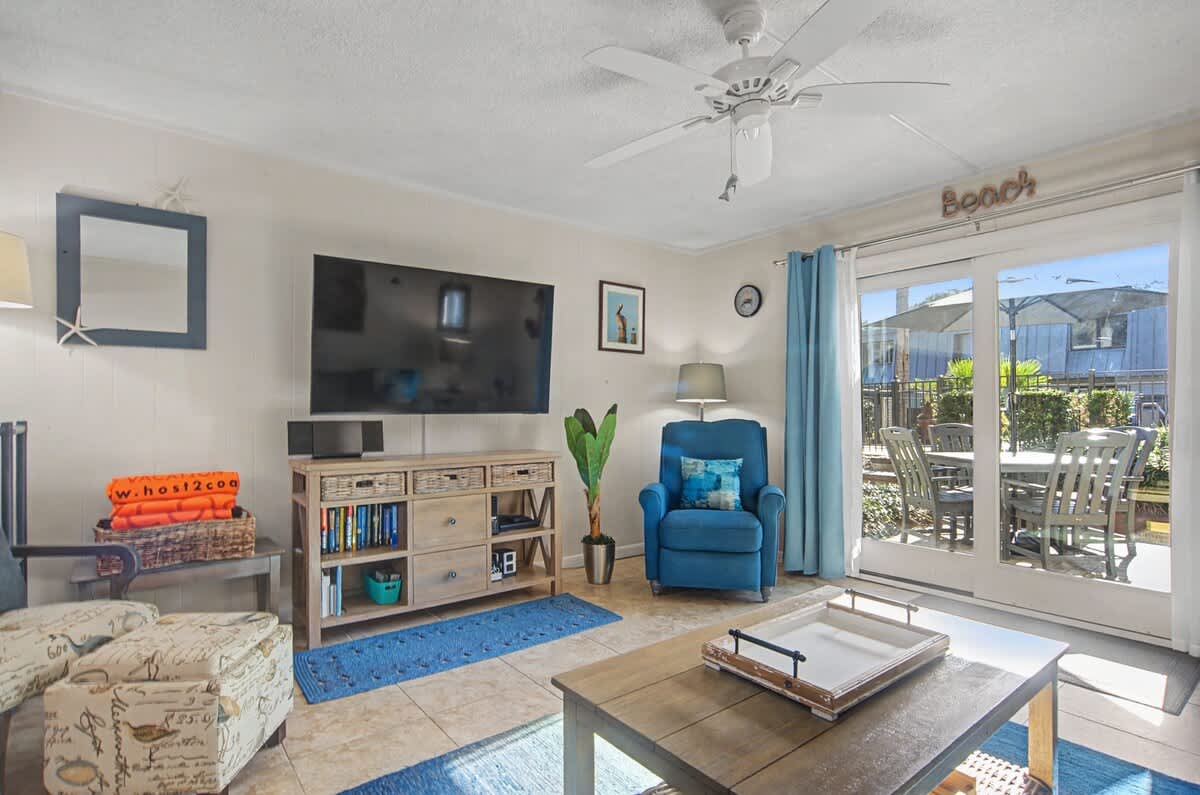 Spacious living room with plush seating, large windows, and a seamless connection to the main living areas—ideal for movie nights, conversation, and easy entertaining.