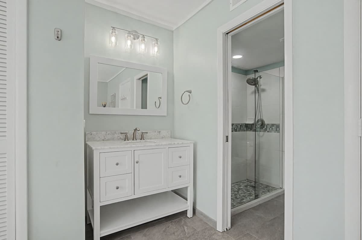 Step into your serene bathroom sanctuary with separate vanity to prepare for the upcoming day.