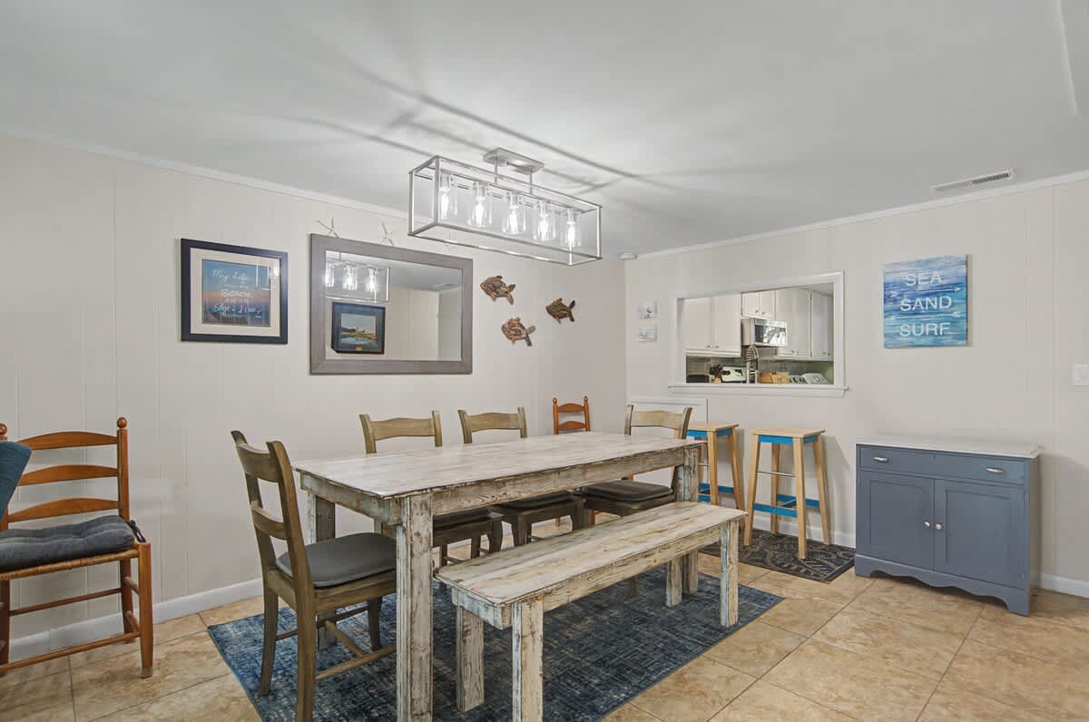 Spacious dining area with ample seating, thoughtfully positioned for easy flow from the kitchen and living space - ideal for both casual breakfasts and relaxed evening dining.