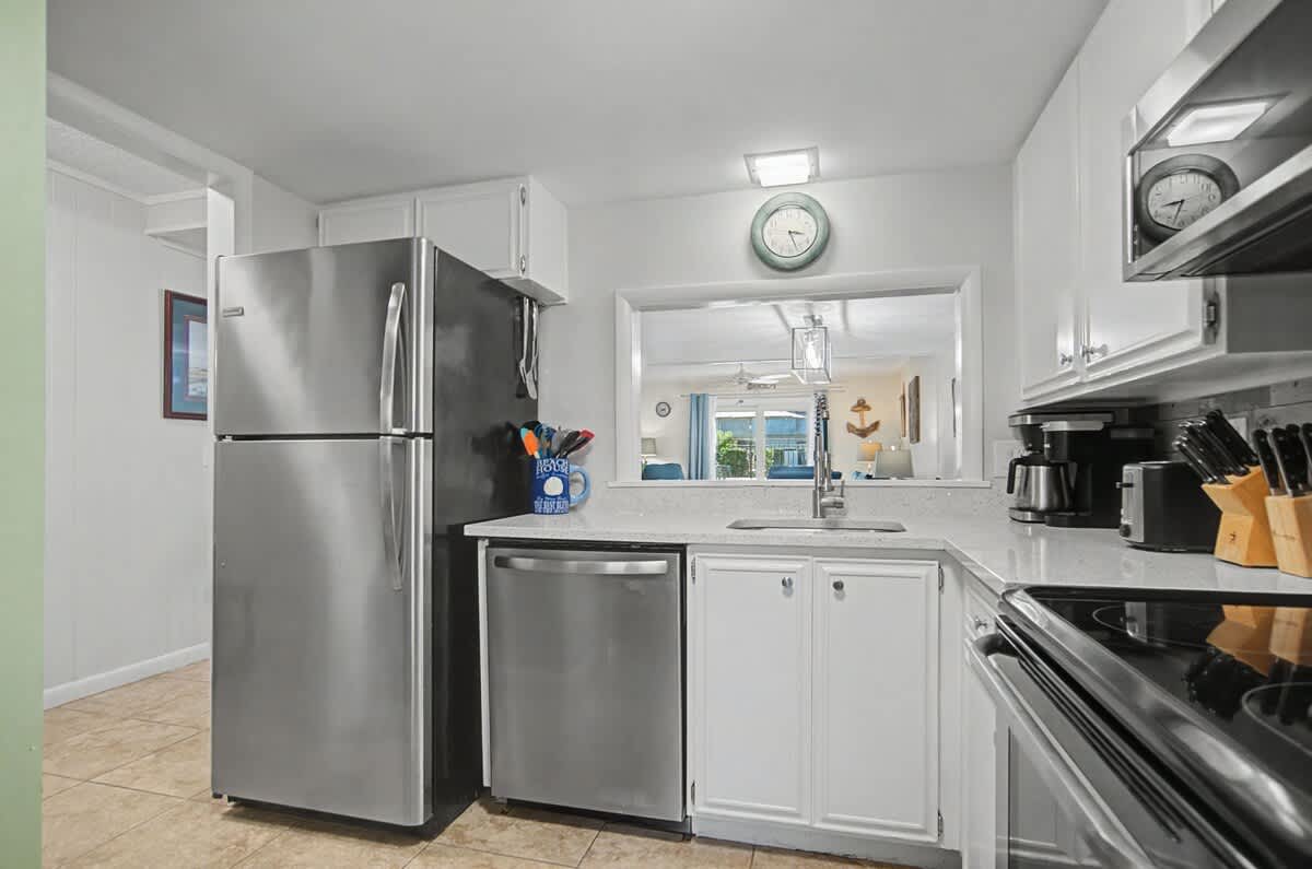 Spacious and well-appointed kitchen featuring full-size appliances, ample counter space, and all the cookware and essentials needed to prepare meals with ease during your stay.