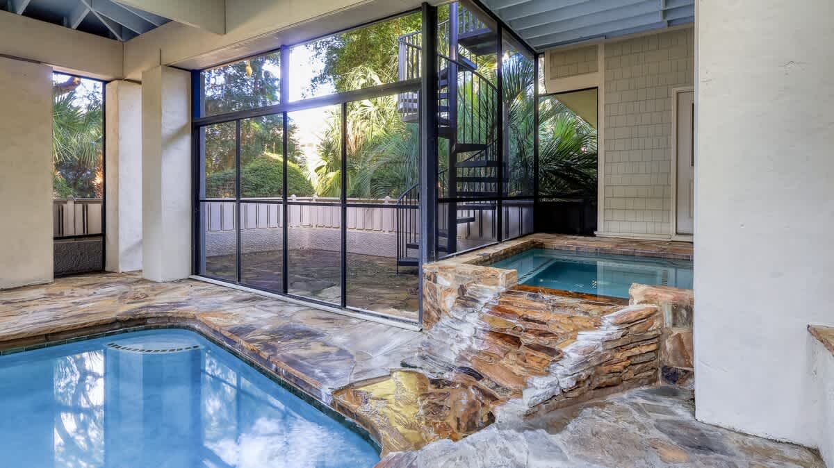 Screened in Pool and Spa Area with Grill Area (Pool and spa heat can be added for an additional cost)