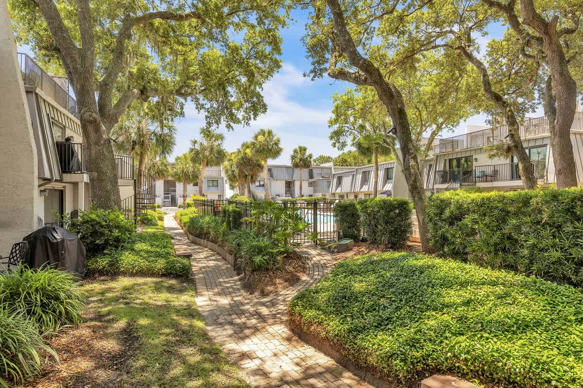 Private Patio Next to Community Pool and Walk to Beach