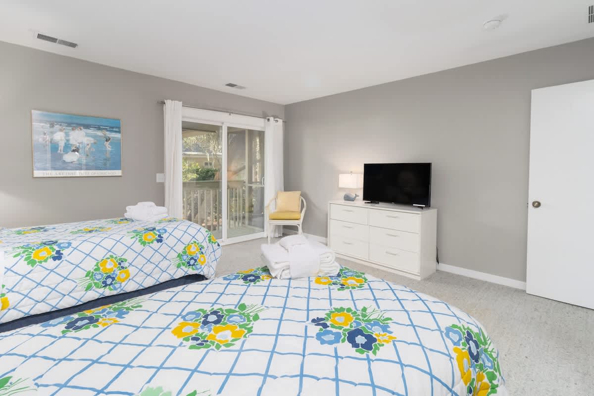 Guest Bedroom with Twin Bed and Access to Patio