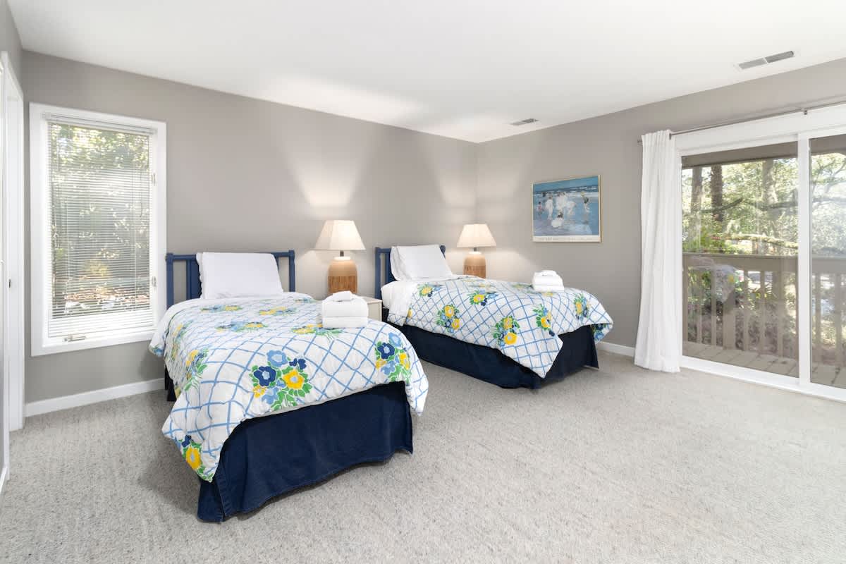 Guest Bedroom with Twin Bed and Access to Patio