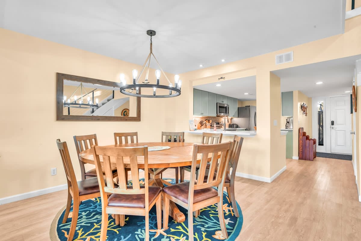 Gather around your spacious dining table for memorable meals, with the modern kitchen just steps away for easy entertaining.