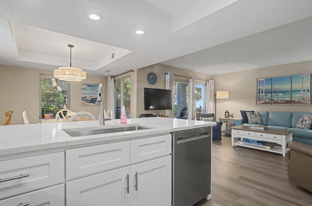 Your open kitchen flows seamlessly into the living area, perfect for preparing meals while staying connected to your group's conversations.