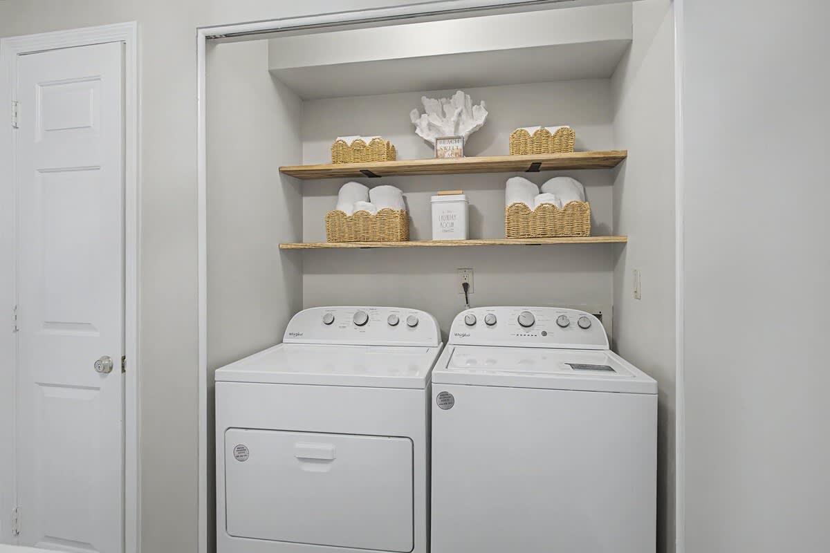 Your in-unit laundry nook keeps you organized with full-size washer and dryer, plus open shelving for all your linens and toiletries.