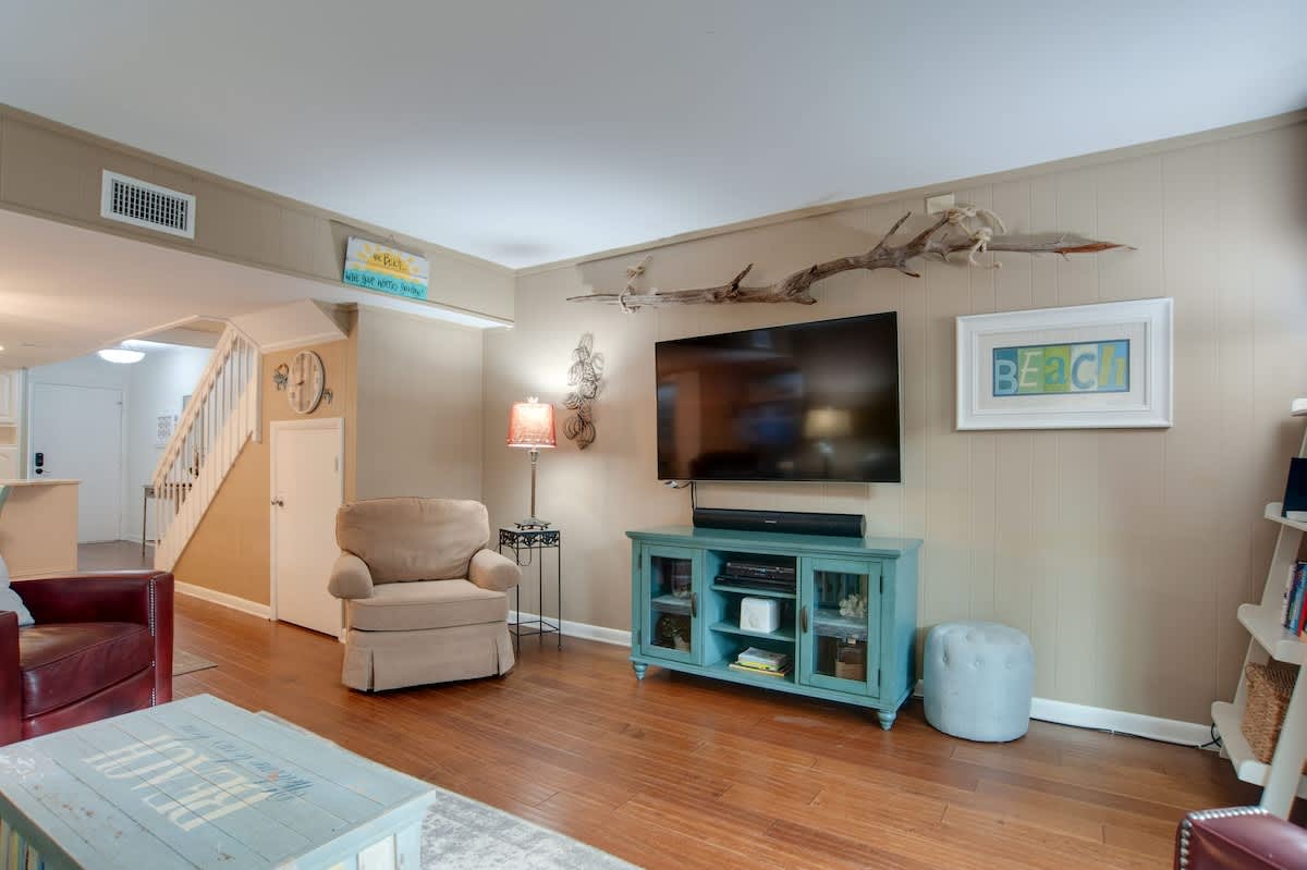 Settle into your cozy coastal living room, where beach-themed decor and comfortable seating create the perfect retreat after seaside adventures.