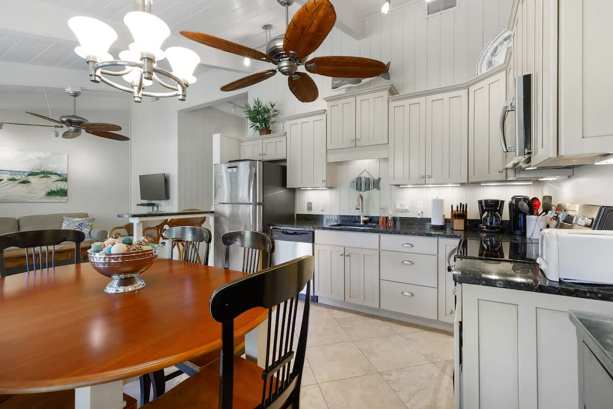 Your spacious kitchen features granite counters, stainless appliances, and a cozy dining area where you'll love gathering for memorable meals together.