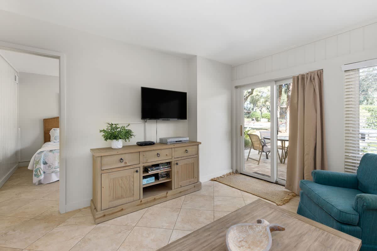 Unwind in your bright living space with modern entertainment and peaceful balcony access for your morning coffee moments.