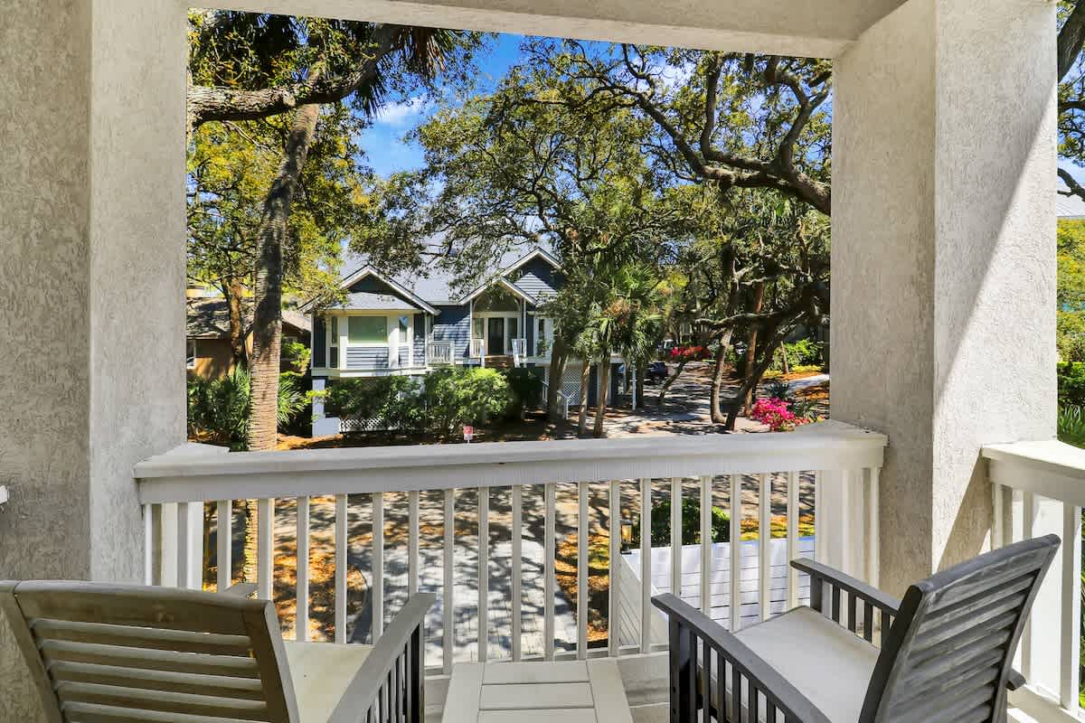 Step out onto your private balcony and soak in peaceful neighborhood views framed by lush trees and charming homes.