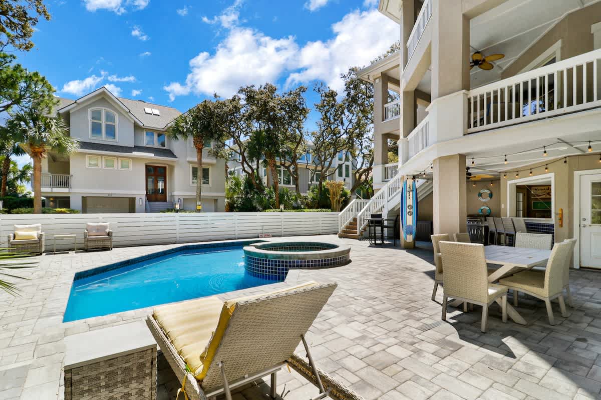 Your private oasis awaits with sparkling pool, hot tub, and covered dining perfect for sunny days and starlit evenings.