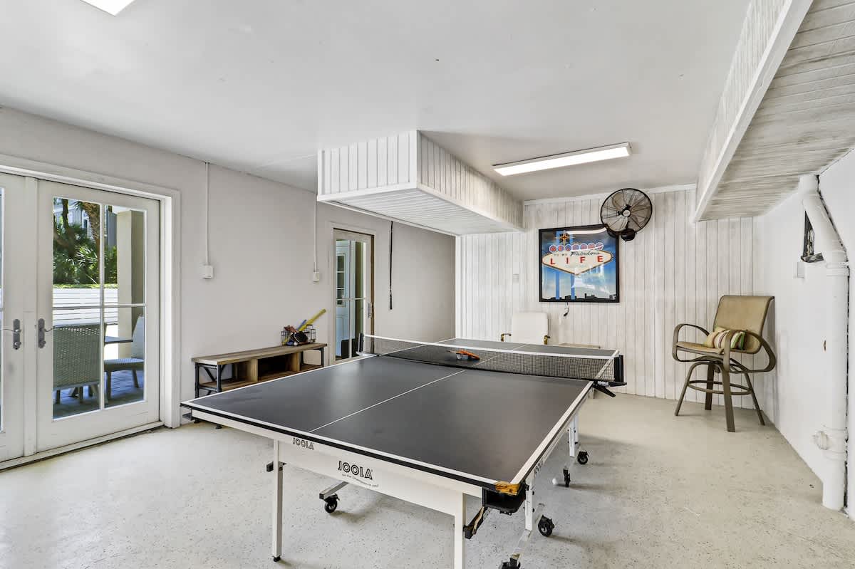 Challenge friends to exciting ping pong matches in your private game room, complete with professional table and tropical views.