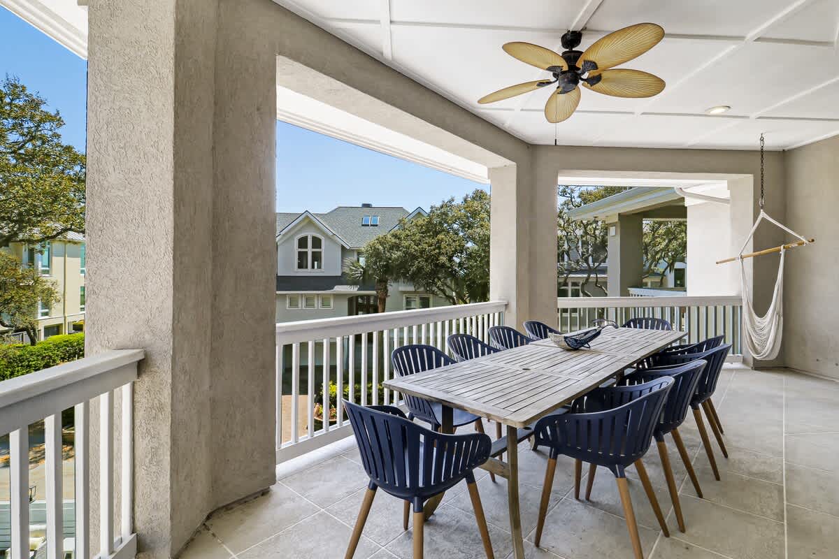 Gather your group around this spacious covered terrace, where meals become memorable with cooling ceiling fans and peaceful neighborhood views.