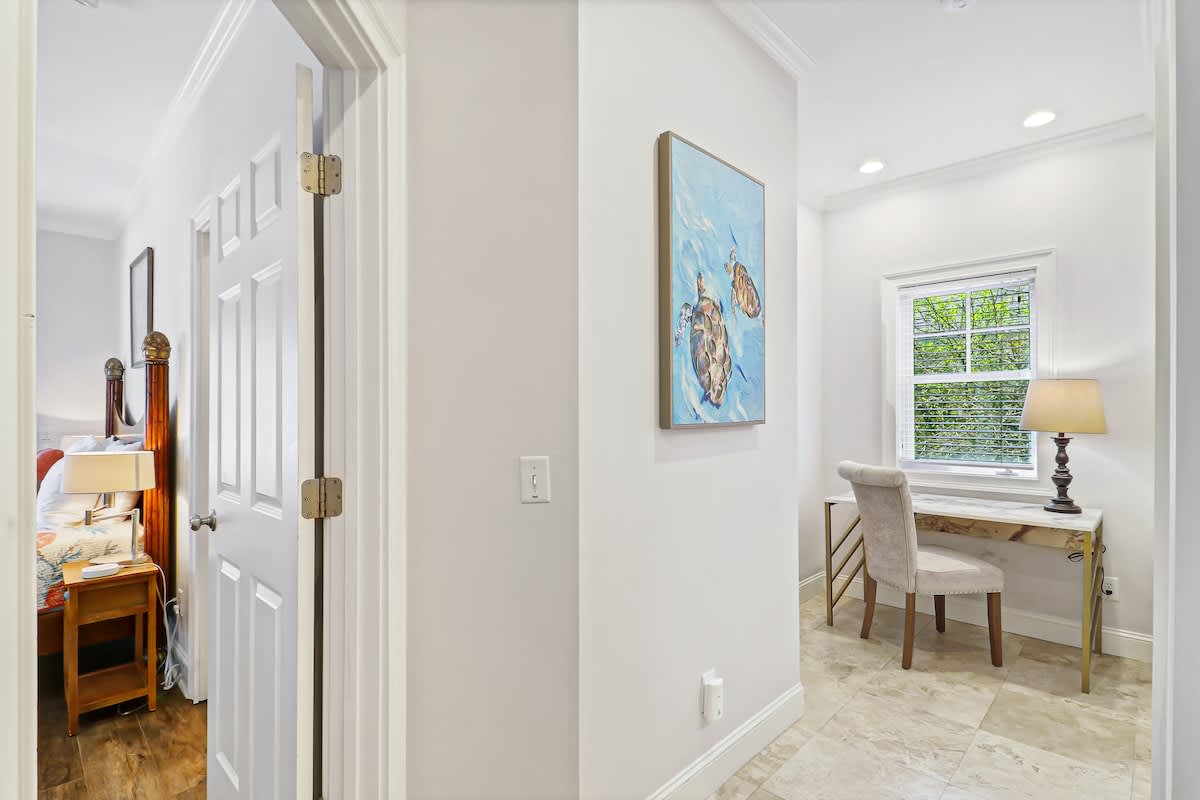 Your bright workspace awaits with natural light streaming through the window, creating the perfect spot for morning coffee or evening planning.