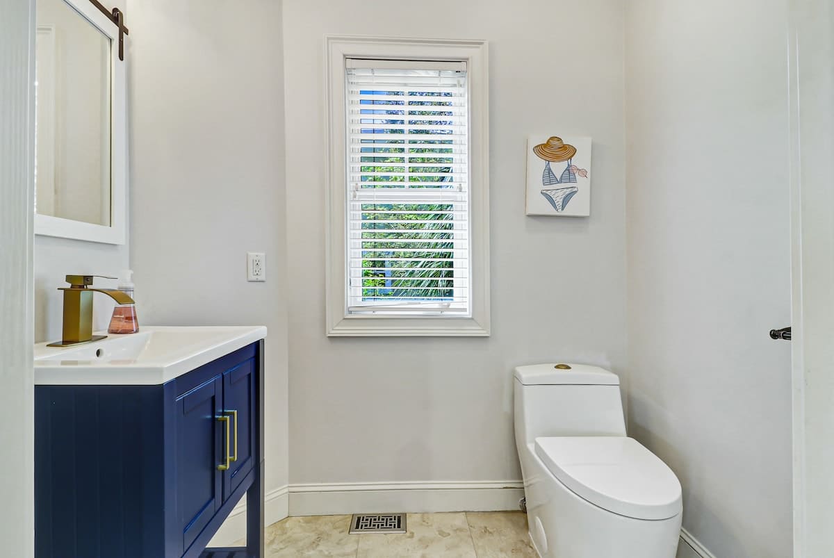 Light and bright mid-level powder room