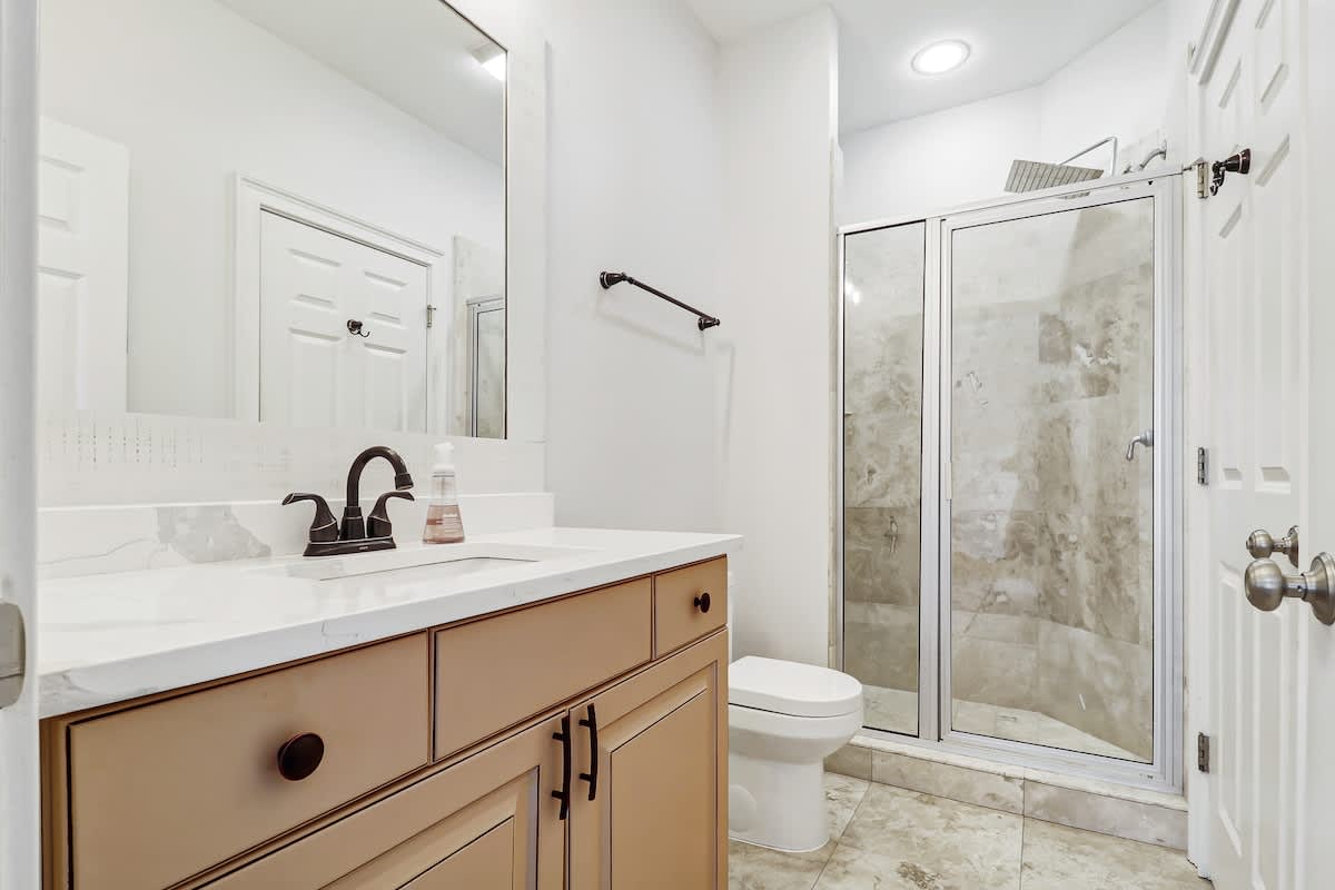 Shared guest bathroom with walk-in shower