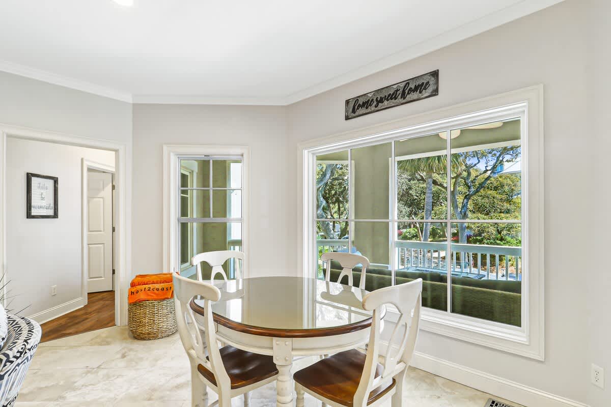 Share meals at your private dining table while enjoying peaceful garden views through expansive windows.