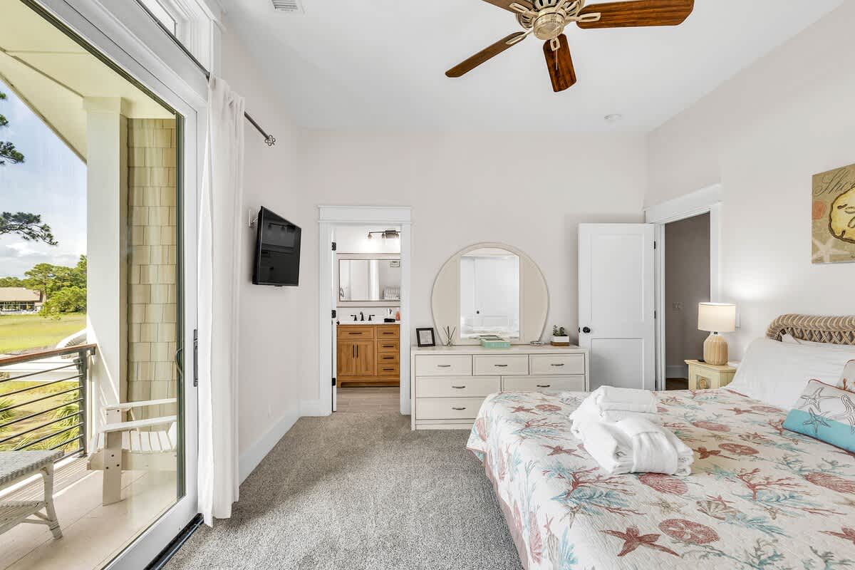 Upstairs Primary Suite with King Bed, En-Suite Bathroom, and Private Balcony