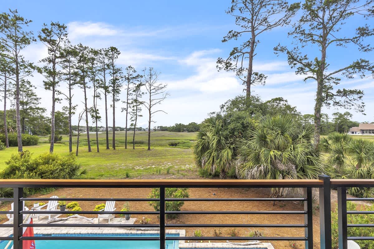 Balcony View of Pool and Marshland