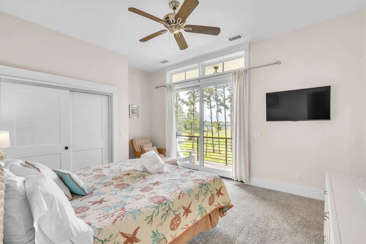 Upstairs Primary Suite with King Bed, En-Suite Bathroom, and Private Balcony