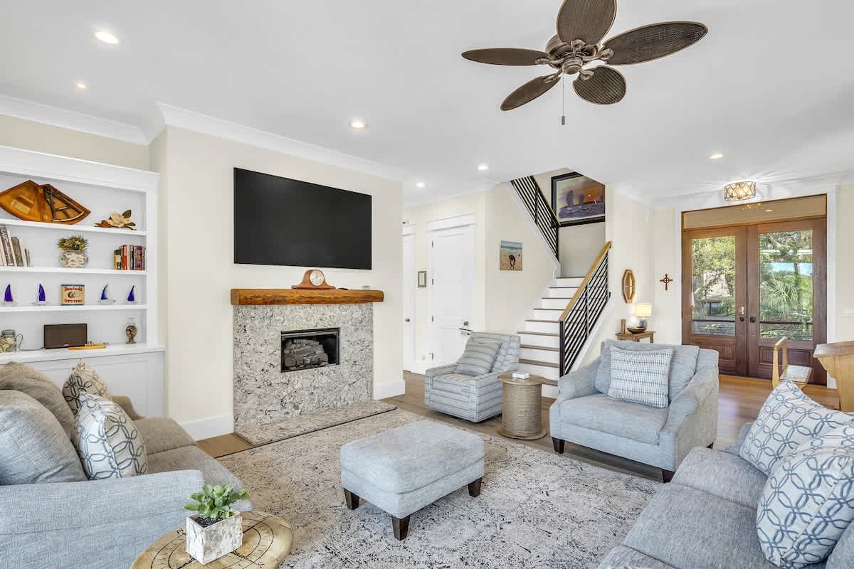 Living Area with Balcony and Hall Toward Primary Suite to the Left of Stairs